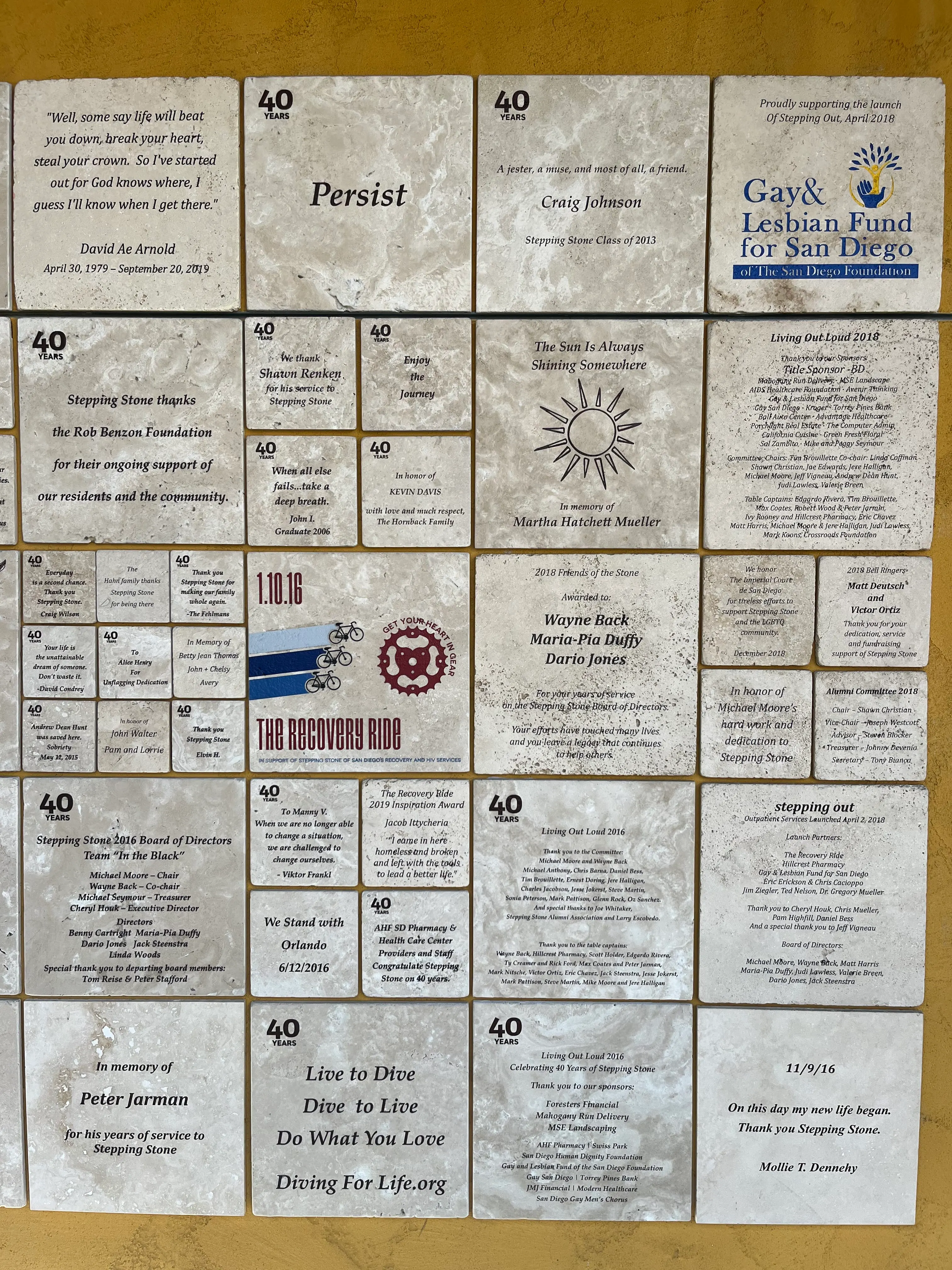 Commemorative tiles from the 40th-anniversary campaign, engraved with names, dedications, and milestones